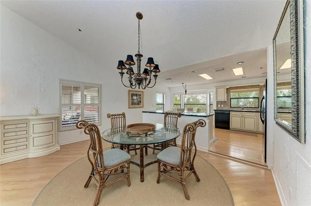 a kitchen with stainless steel appliances kitchen island granite countertop a stove a sink and a microwave