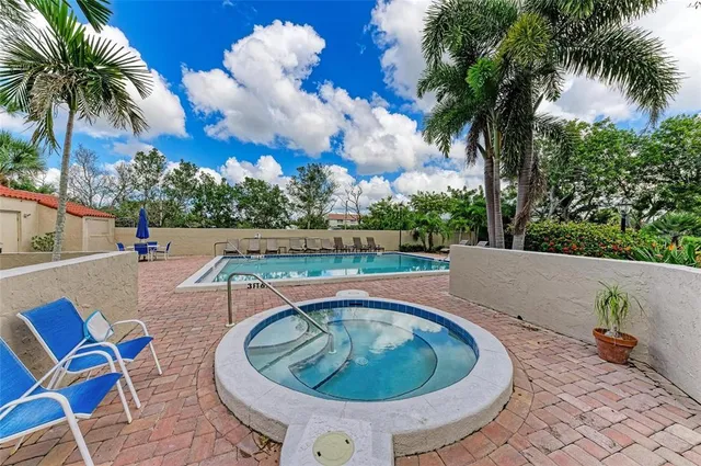 a view of swimming pool with a yard and lake view