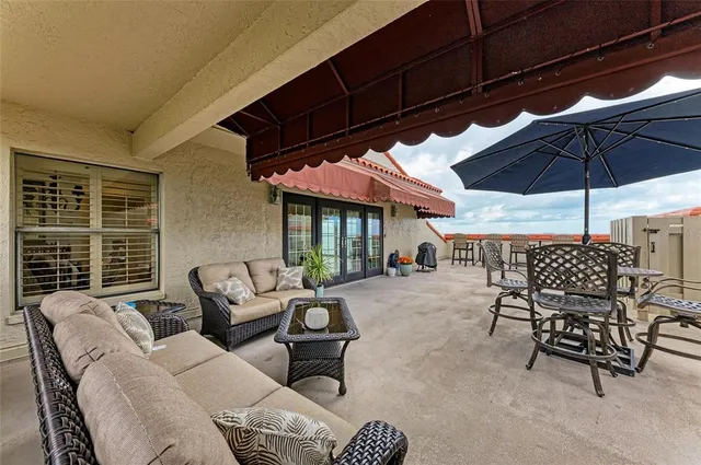 a living room with furniture large window and flat screen tv