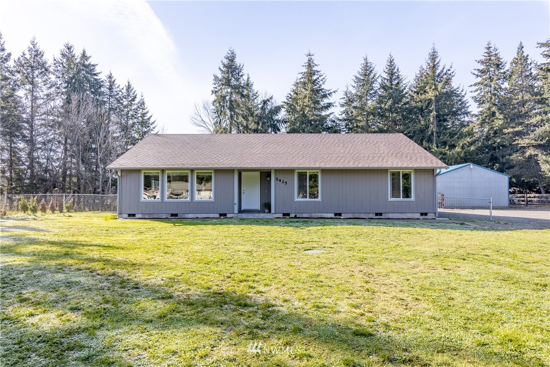 5425 188th Avenue Southwest Rochester, WA 98579 - Photo 1 of 40 a front view of a house with swimming pool
