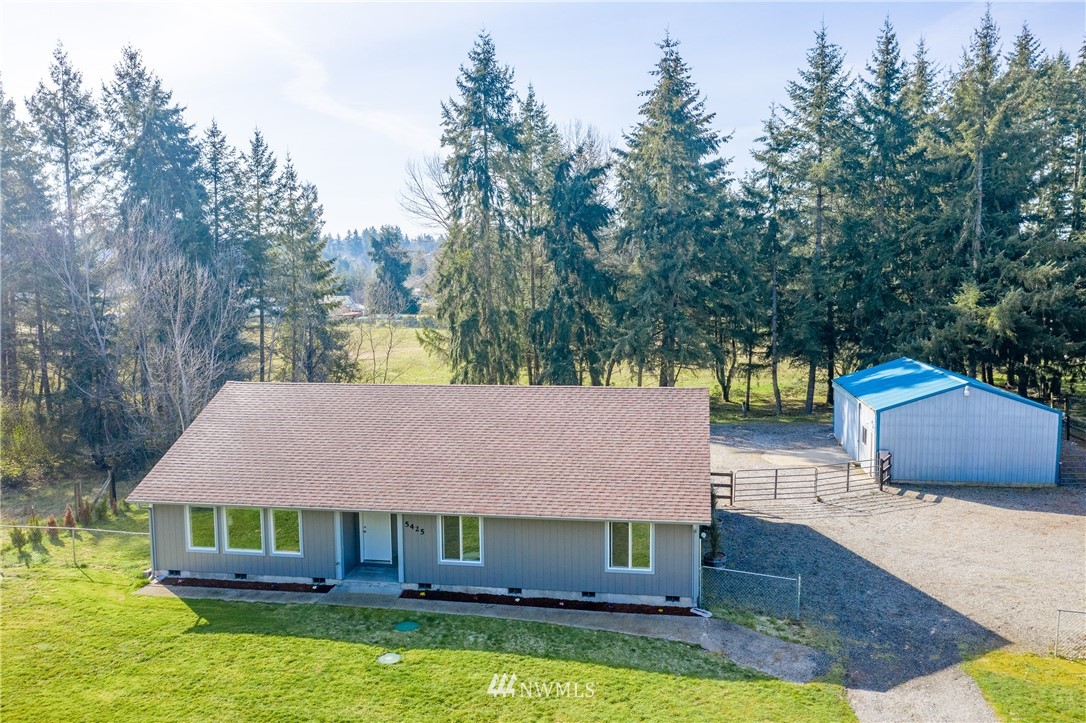 5425 188th Avenue Southwest Rochester, WA 98579 - Photo 2 of 40 a front view of a house with swimming pool