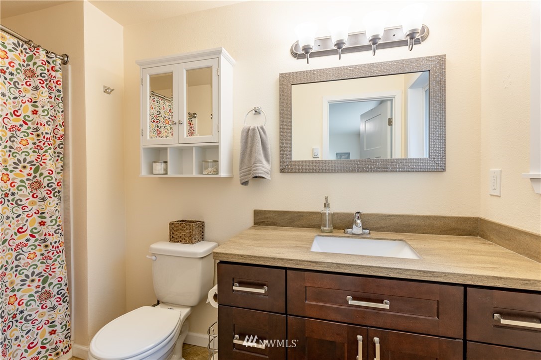 5425 188th Avenue Southwest Rochester, WA 98579 - Photo 22 of 40 a bathroom with a toilet sink and mirror