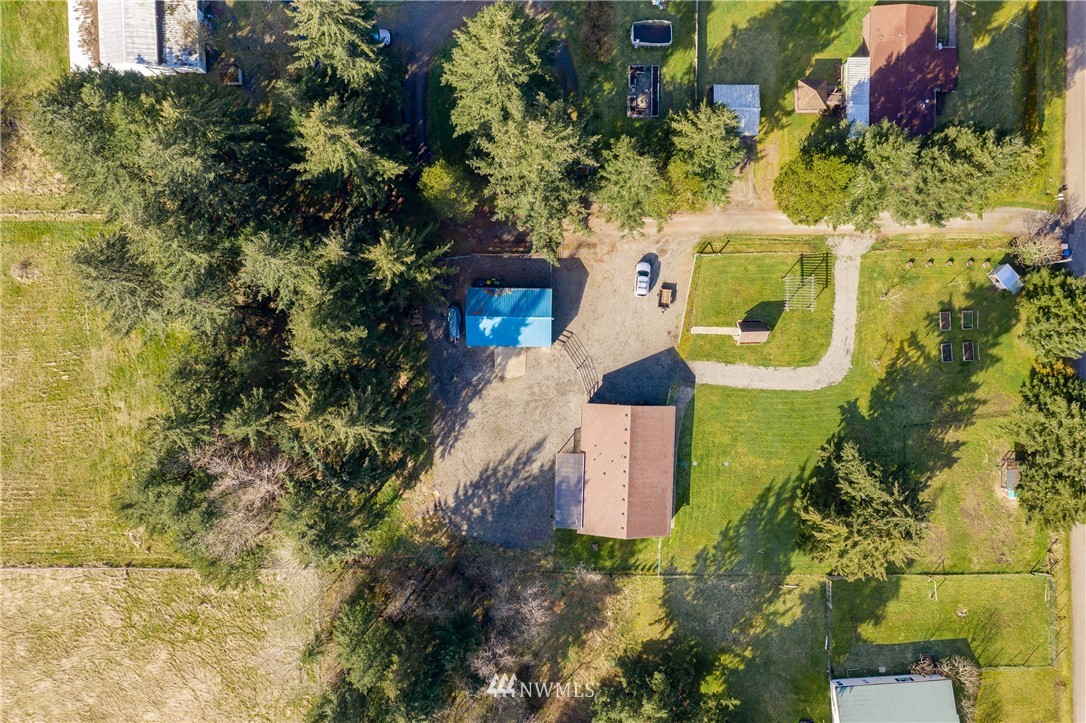 5425 188th Avenue Southwest Rochester, WA 98579 - Photo 36 of 40 an aerial view of a house with a yard and garden