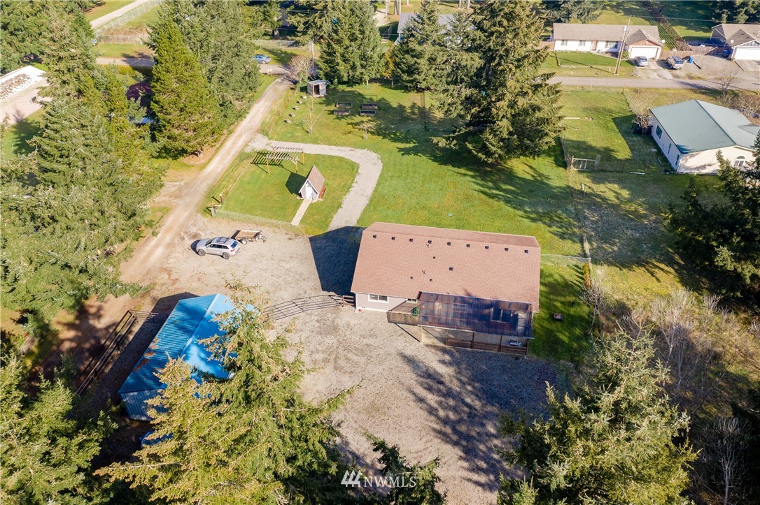 5425 188th Avenue Southwest Rochester, WA 98579 - Photo 39 of 40 an aerial view of a house with a yard and trees