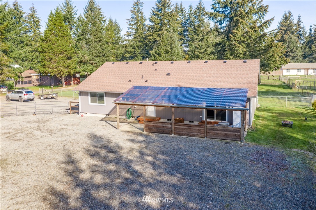 5425 188th Avenue Southwest Rochester, WA 98579 - Photo 40 of 40 a view of a house with a yard and large tree