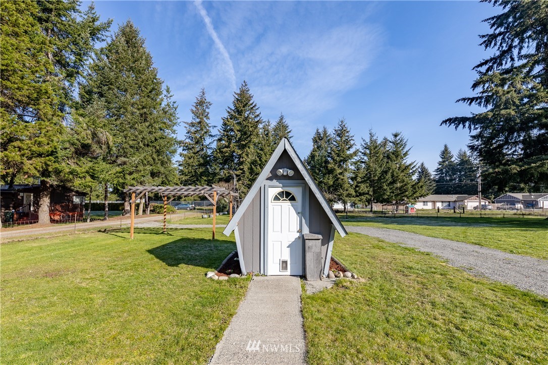 5425 188th Avenue Southwest Rochester, WA 98579 - Photo 5 of 40 a house with swimming pool in front of it