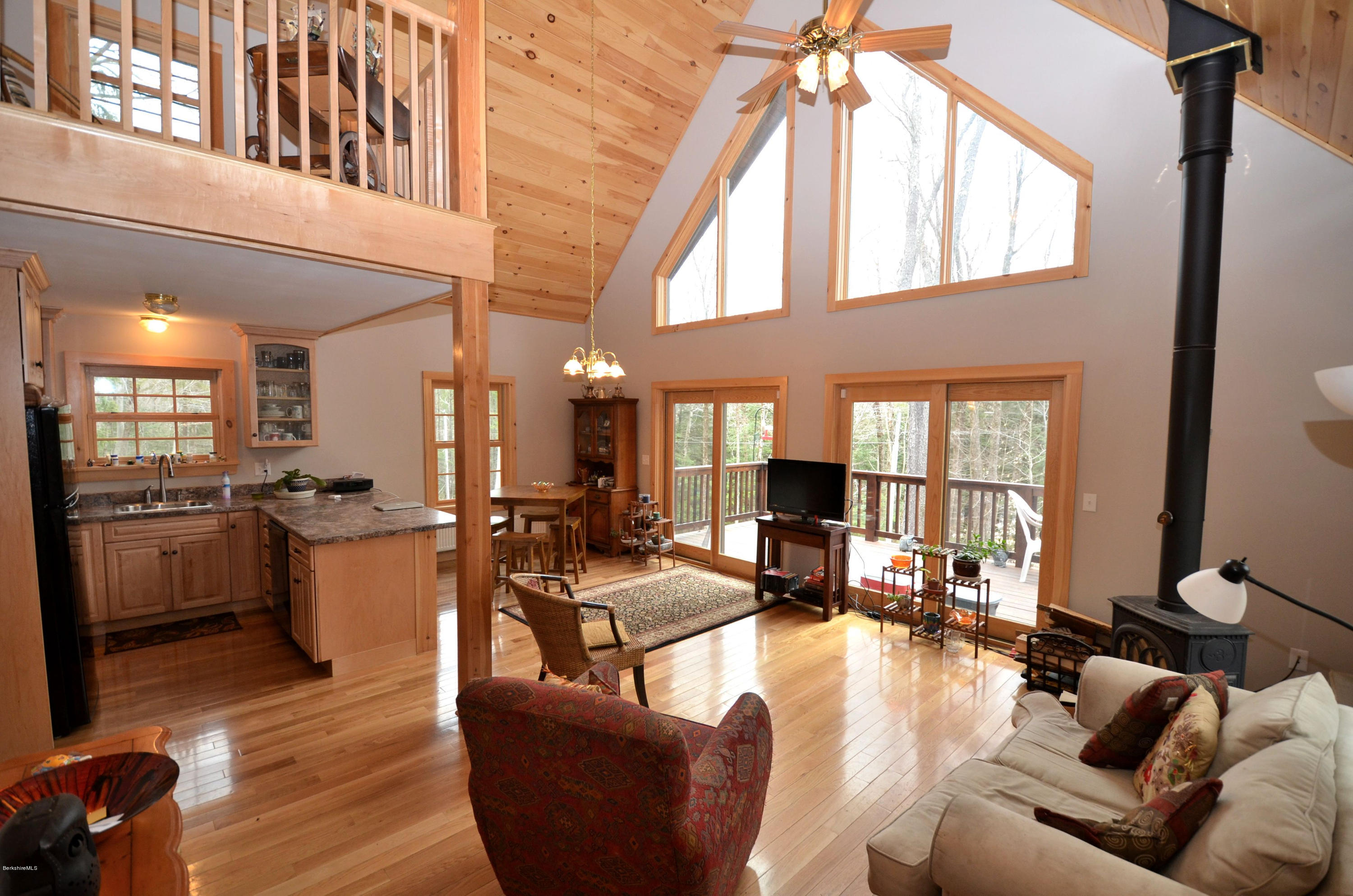 156 Old Pond Road Becket, MA 01223 - Photo 3 of 28 a living room with fireplace furniture and a large window