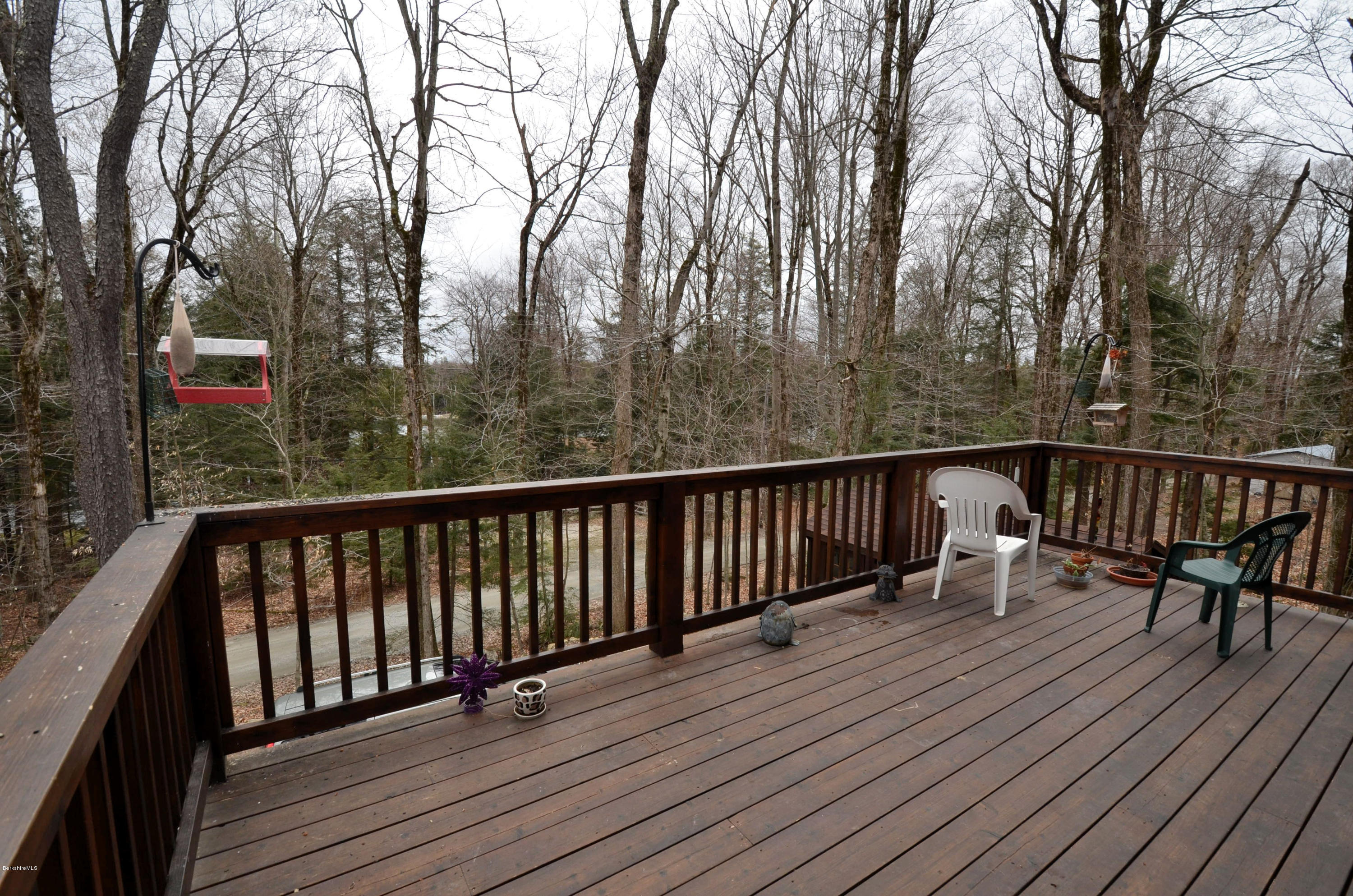 156 Old Pond Road Becket, MA 01223 - Photo 22 of 28 a view of balcony with wooden floor and outdoor seating