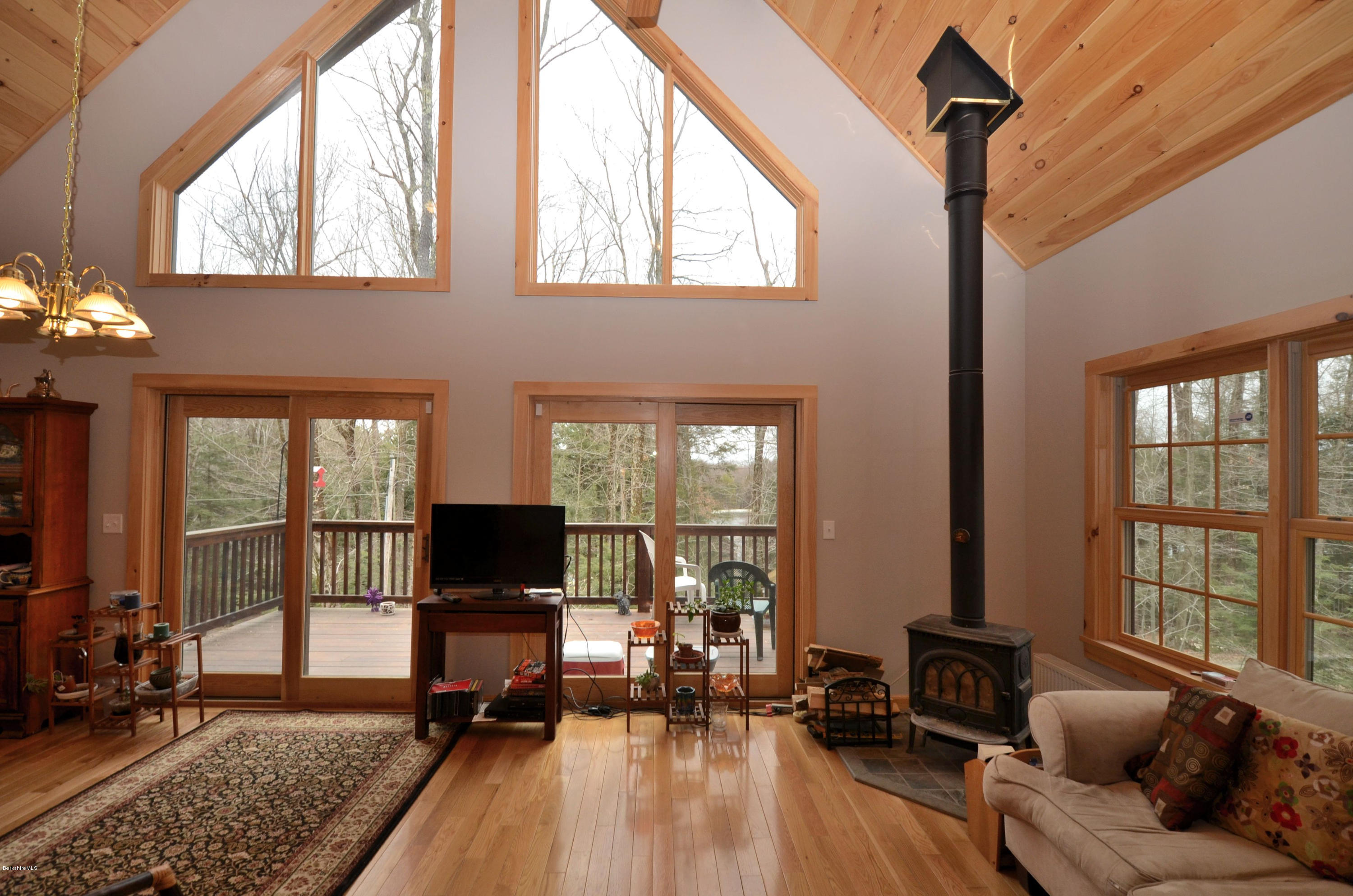 156 Old Pond Road Becket, MA 01223 - Photo 5 of 28 a living room with furniture fireplace and flat screen tv