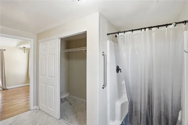 a bathroom with a shower and a tub