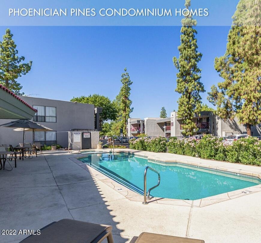 17211 North 35th Avenue, Unit A207 Phoenix, AZ 85053 - Photo 1 of 17 a view of a tennis ground with large trees