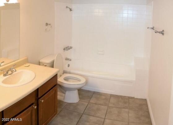 17211 North 35th Avenue, Unit A207 Phoenix, AZ 85053 - Photo 15 of 17 a bathroom with a sink a toilet and vanity