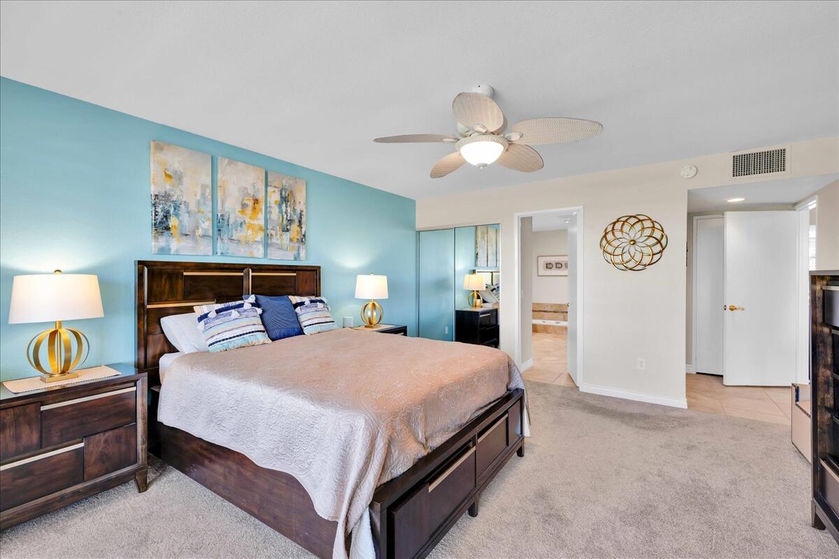 43 Sunrise Drive Rancho Mirage, CA 92270 - Photo 24 of 56 a bedroom with a bed and painting on the wall