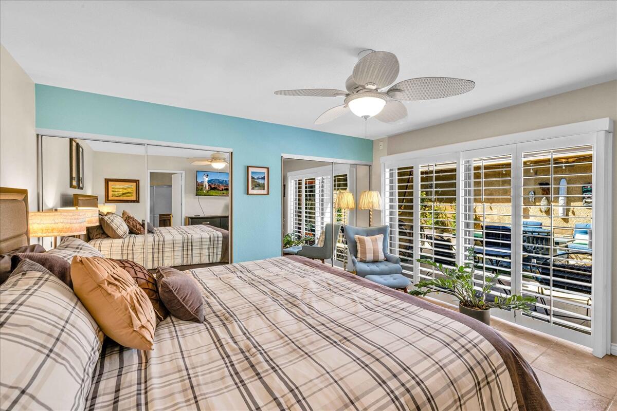 43 Sunrise Drive Rancho Mirage, CA 92270 - Photo 30 of 56 a bedroom with a large bed and a large window