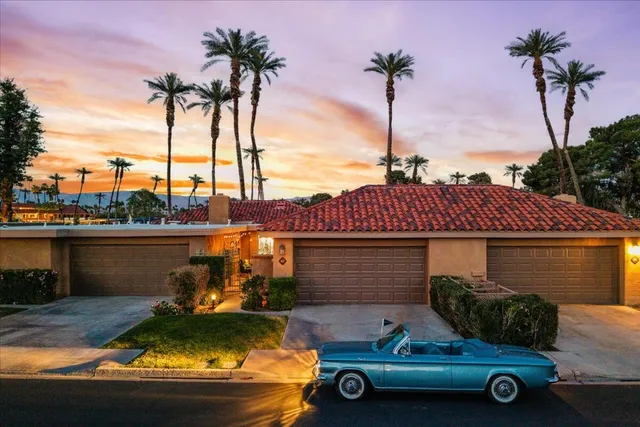 a bed room with a bed and a night stand