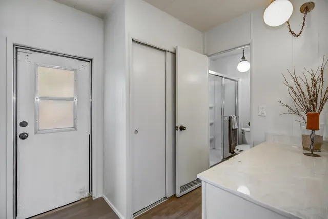 a view of a bathroom with sink and shower