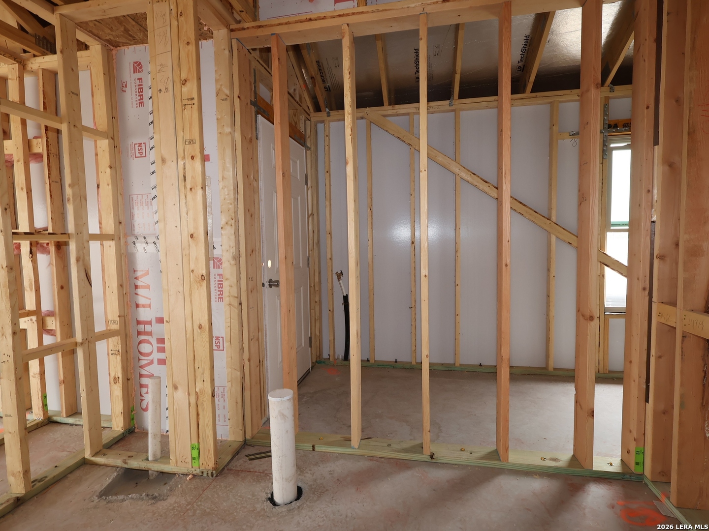 4810 Rio Ruidoso Von Ormy, TX 78073 - Photo 23 of 31 a view of an empty room with wooden floor