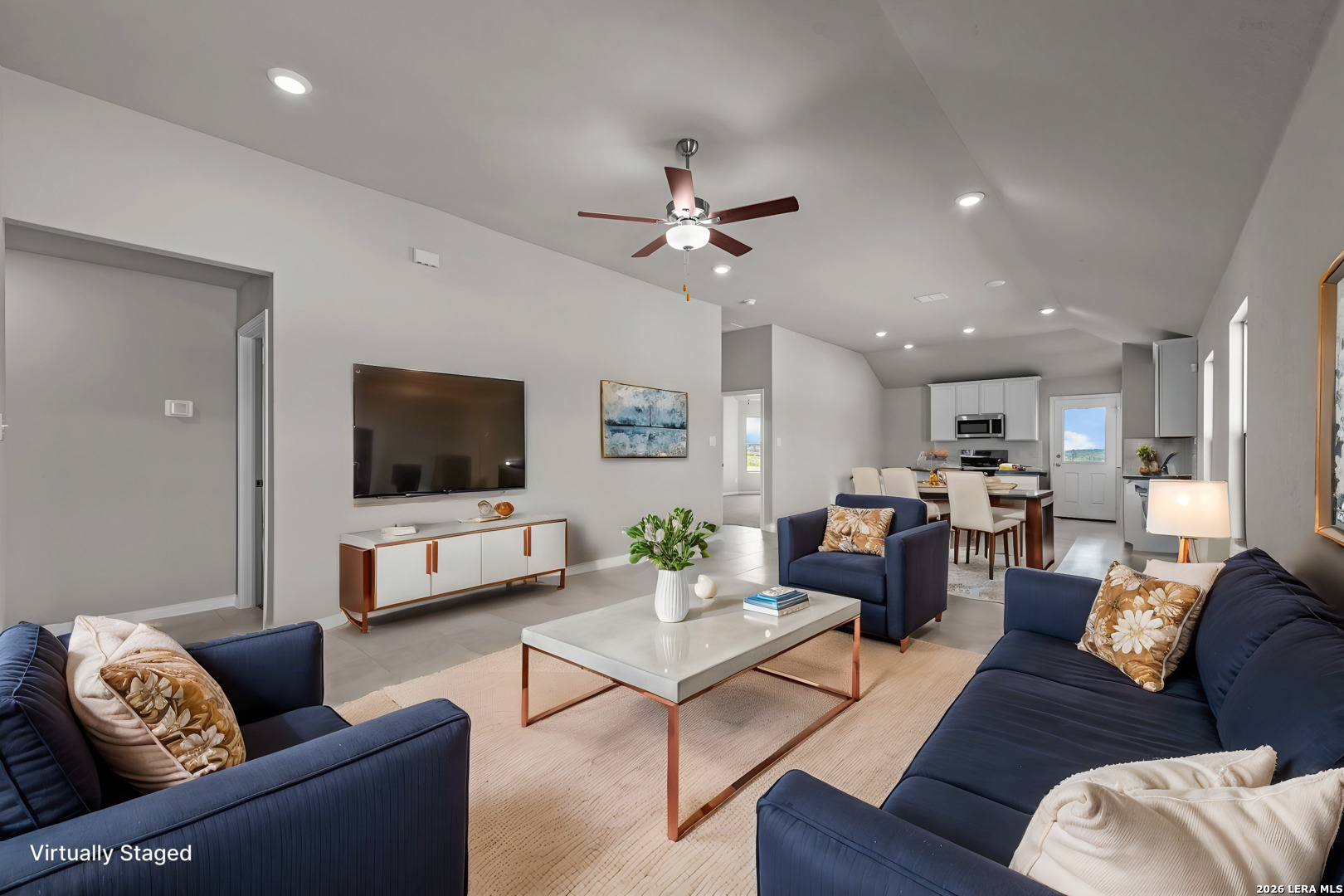 4810 Rio Ruidoso Von Ormy, TX 78073 - Photo 6 of 31 a living room with furniture and a flat screen tv
