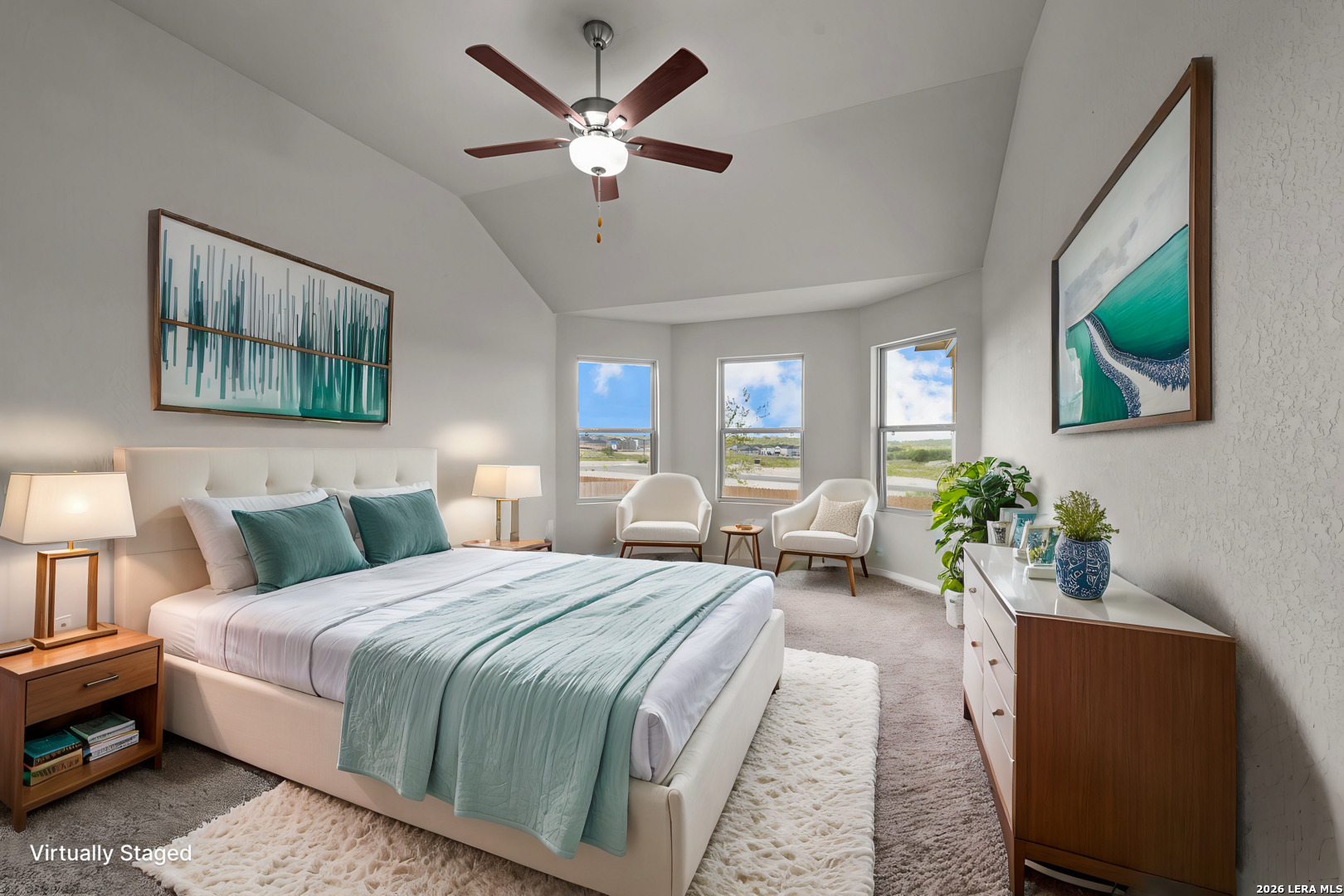 4810 Rio Ruidoso Von Ormy, TX 78073 - Photo 7 of 31 a bedroom with a bed a couch and a potted plant