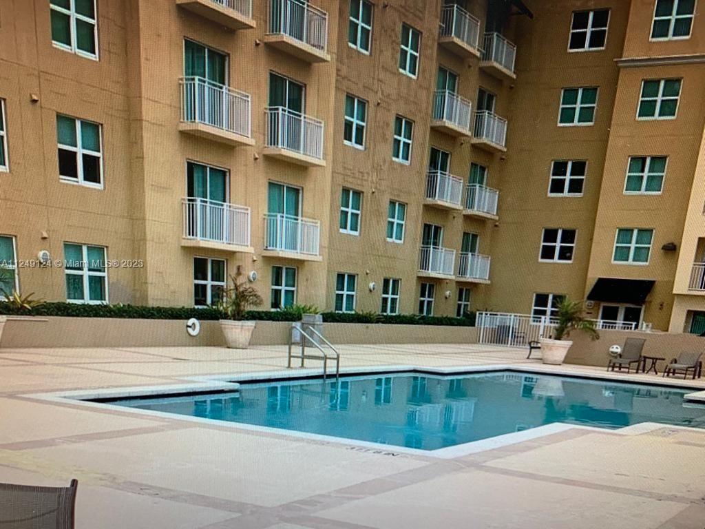 Central Gables Coral Gables, FL 33134 - Photo 4 of 14 a view of a building with a swimming pool