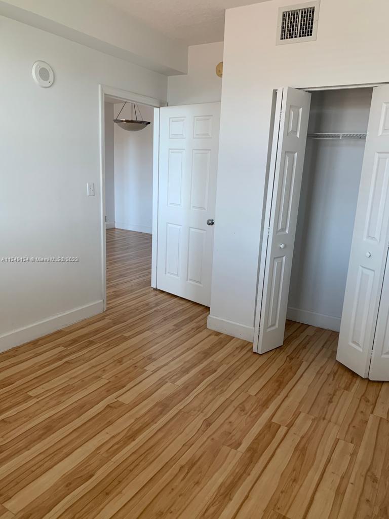 Central Gables Coral Gables, FL 33134 - Photo 10 of 14 a view of wooden floor in an empty room