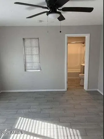 a view of an empty room and a window