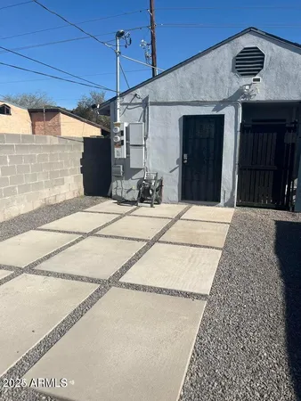 a patio with table and chairs