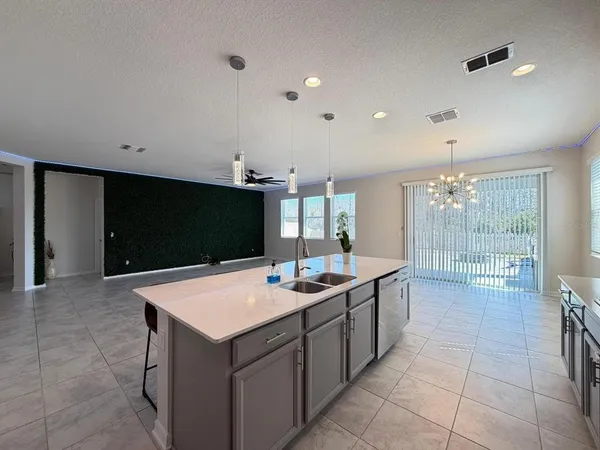 a kitchen with a sink and cabinets