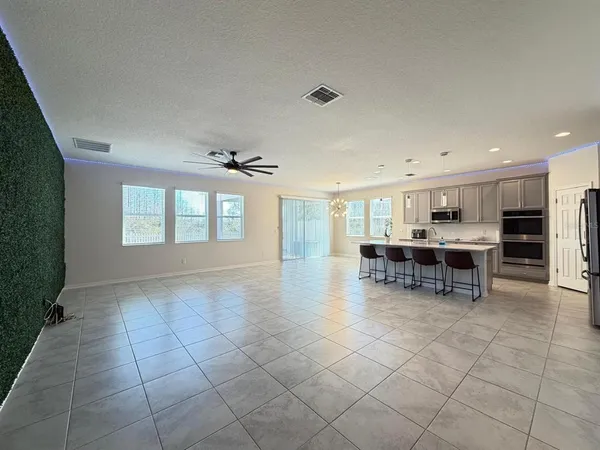 a room with furniture and kitchen view