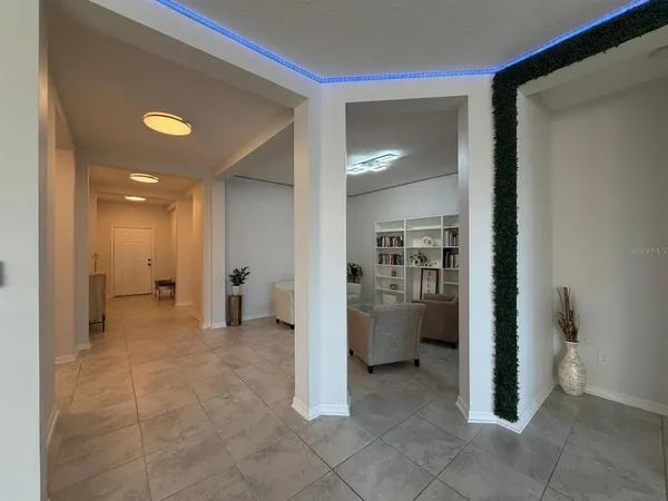 a view of a hallway with bathroom and bathroom
