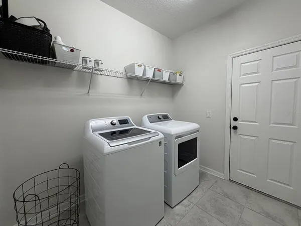 a utility room with dryer and washer