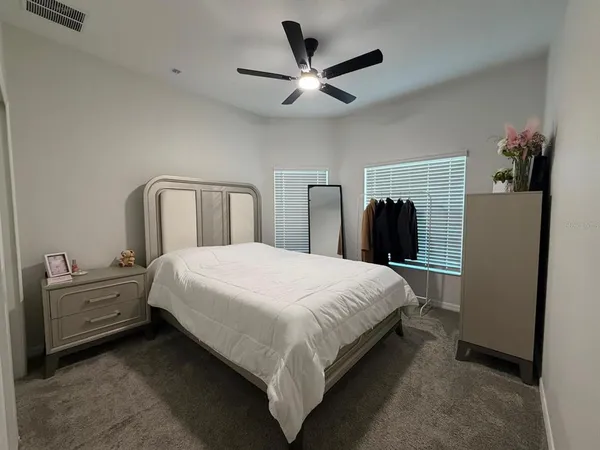 a bedroom with a bed and a closet
