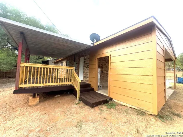 a view of deck with a chair and swing