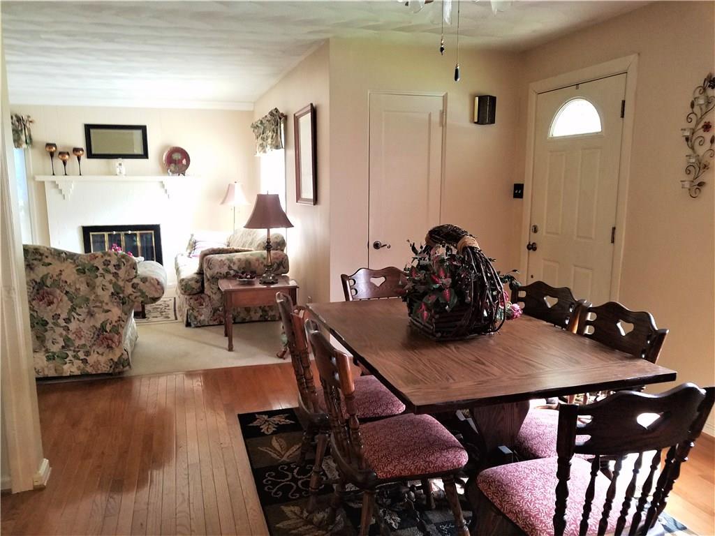 106 Artlee Avenue Butler, PA 16001 - Photo 2 of 24 Beautiful open floor plan from the kitchen to dining to living room. Hardwood floors and elegant white carpet in the living room area with fireplace.