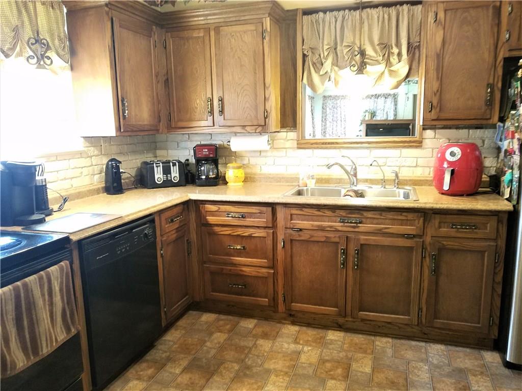 106 Artlee Avenue Butler, PA 16001 - Photo 5 of 24 Another angle of the kitchen with a pass through window to the family room.