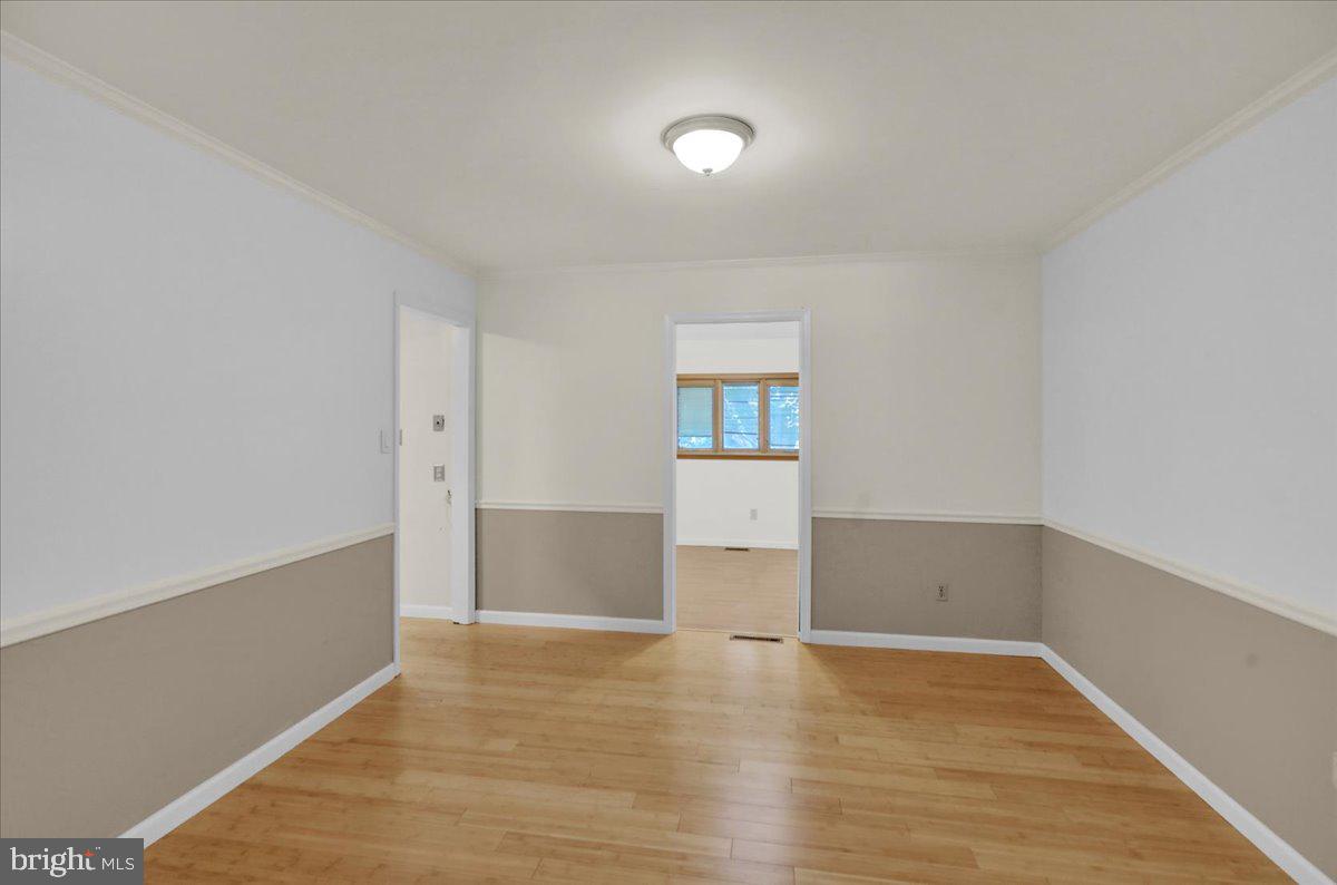 802 Apple Drive Reading, PA 19610 - Photo 12 of 47 a view of empty room with wooden floor and fan
