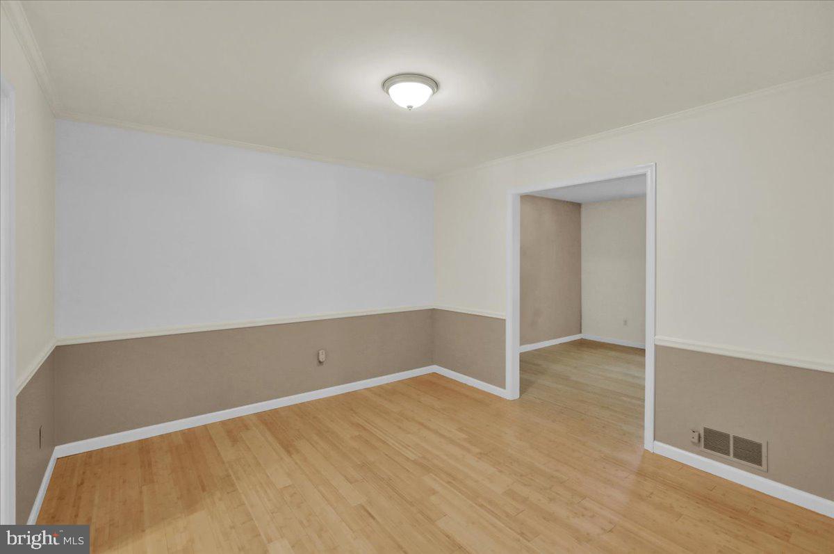 802 Apple Drive Reading, PA 19610 - Photo 13 of 47 an empty room with wooden floor and windows
