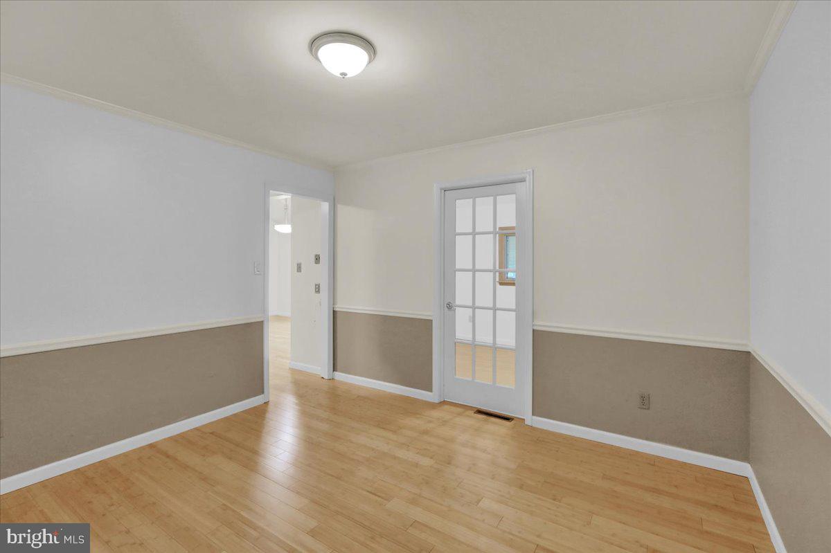 802 Apple Drive Reading, PA 19610 - Photo 14 of 47 an empty room with wooden floor and windows