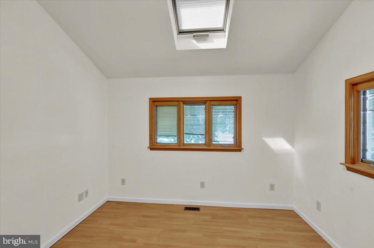 802 Apple Drive Reading, PA 19610 - Photo 16 of 47 a view of a room with wooden floor and a window