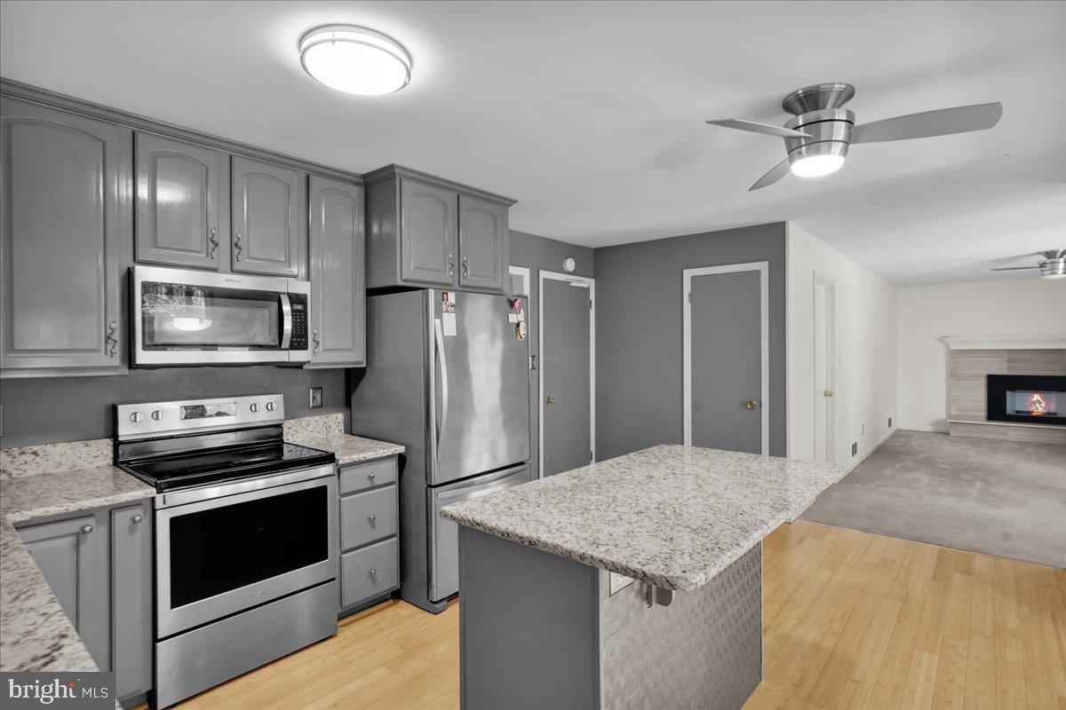 802 Apple Drive Reading, PA 19610 - Photo 20 of 47 a kitchen with kitchen island a counter top space appliances and cabinets