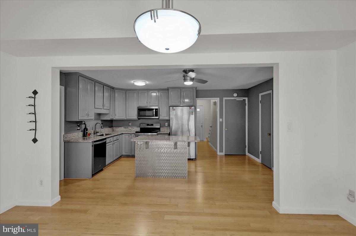 802 Apple Drive Reading, PA 19610 - Photo 23 of 47 a view of kitchen with kitchen island stainless steel appliances refrigerator stove microwave and cabinets