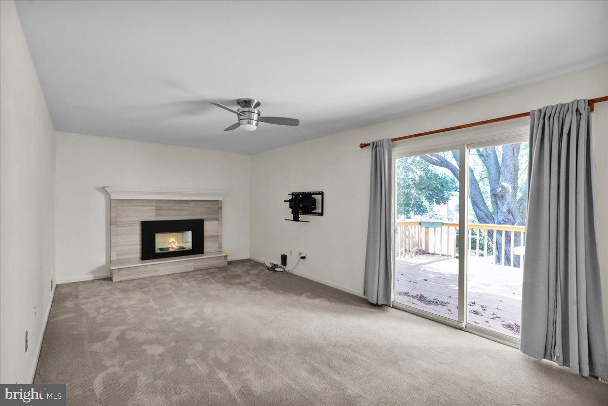 802 Apple Drive Reading, PA 19610 - Photo 26 of 47 a view of an empty room with a fireplace and a window