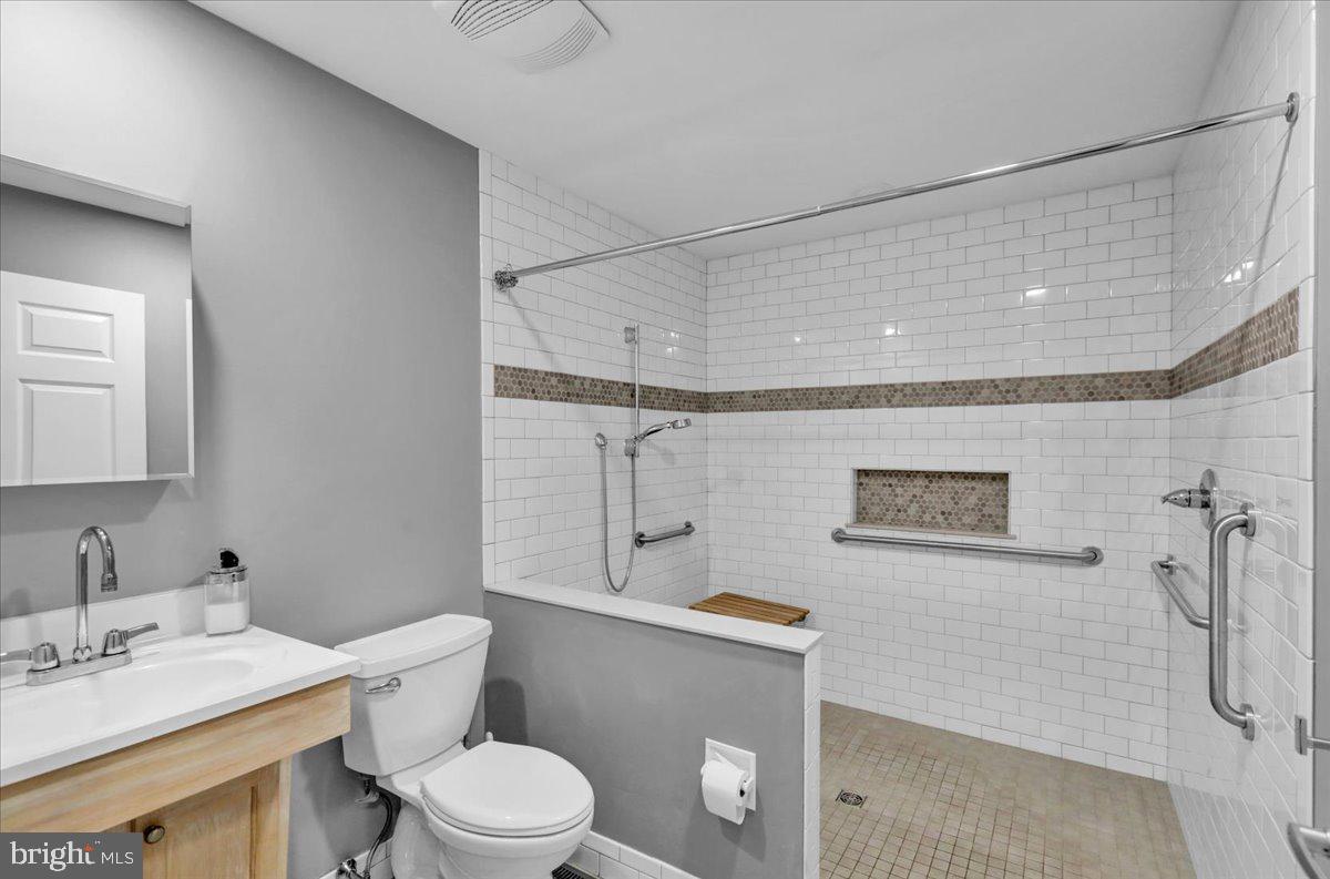 802 Apple Drive Reading, PA 19610 - Photo 29 of 47 a bathroom with a sink mirror vanity and toilet