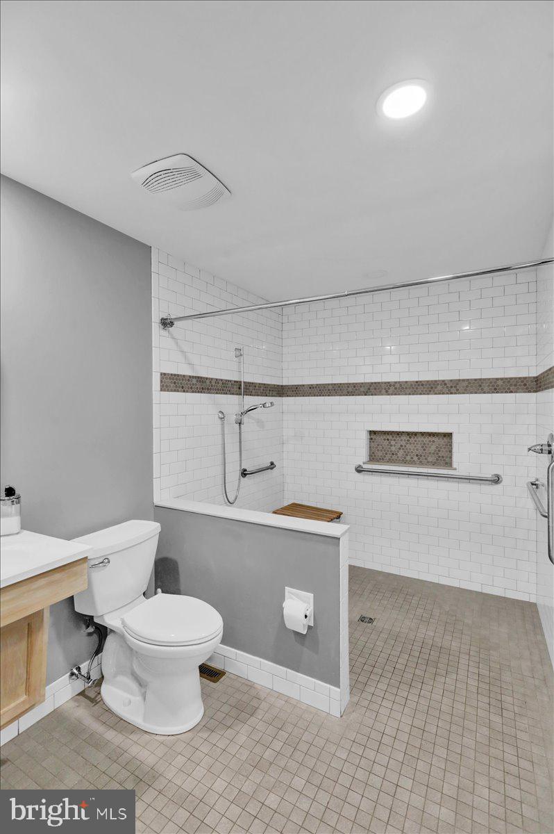 802 Apple Drive Reading, PA 19610 - Photo 30 of 47 a bathroom with a toilet a sink and vanity