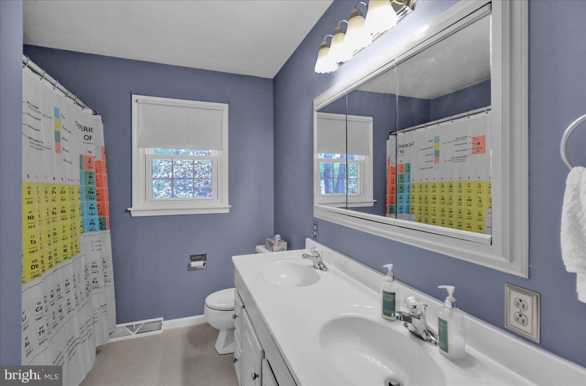802 Apple Drive Reading, PA 19610 - Photo 33 of 47 a bathroom with a toilet sink and mirror