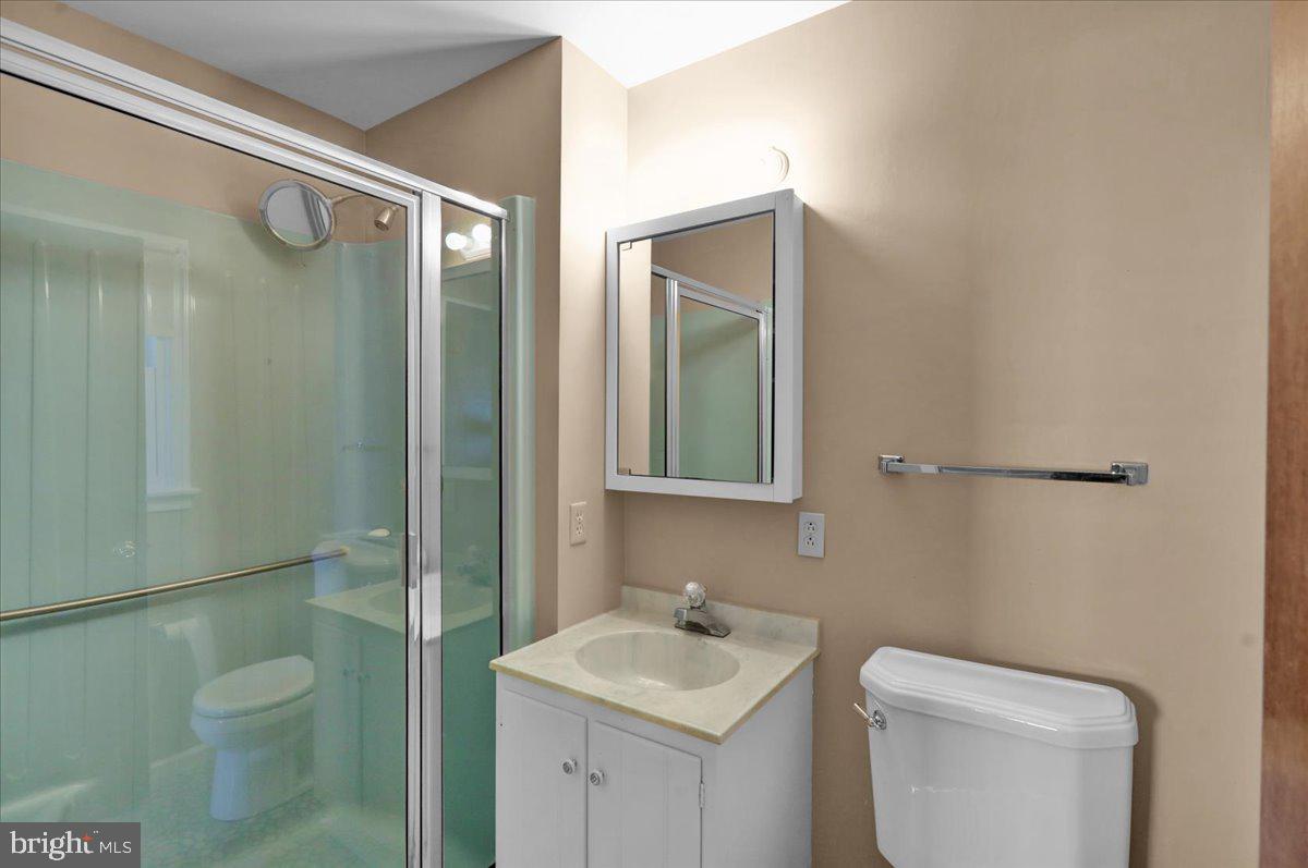802 Apple Drive Reading, PA 19610 - Photo 34 of 47 a bathroom with a toilet sink vanity and mirror
