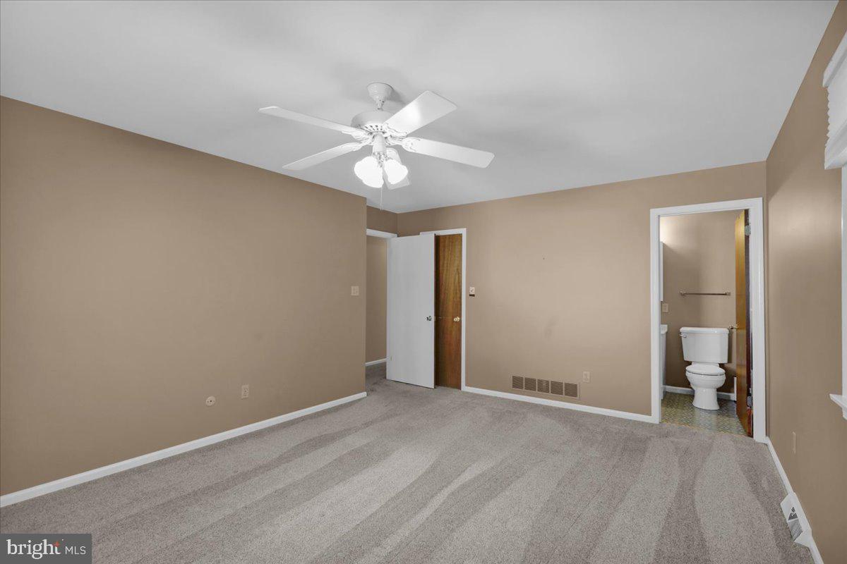 802 Apple Drive Reading, PA 19610 - Photo 35 of 47 a view of an empty room with a chandelier fan
