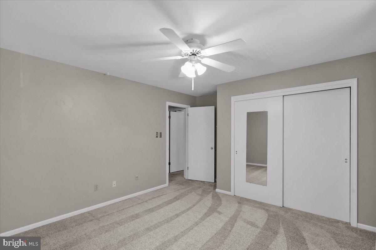 802 Apple Drive Reading, PA 19610 - Photo 37 of 47 an empty room with closet and a ceiling fan
