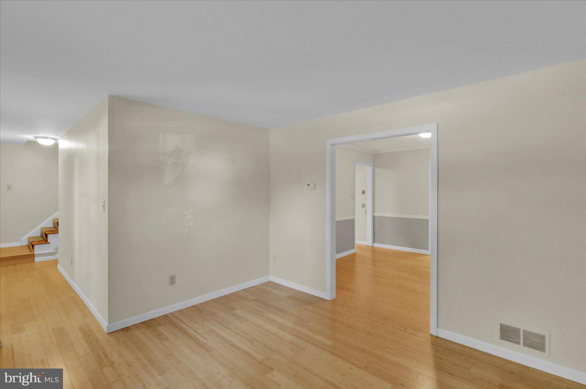 802 Apple Drive Reading, PA 19610 - Photo 10 of 47 a view of an empty room with wooden floor and a bathroom