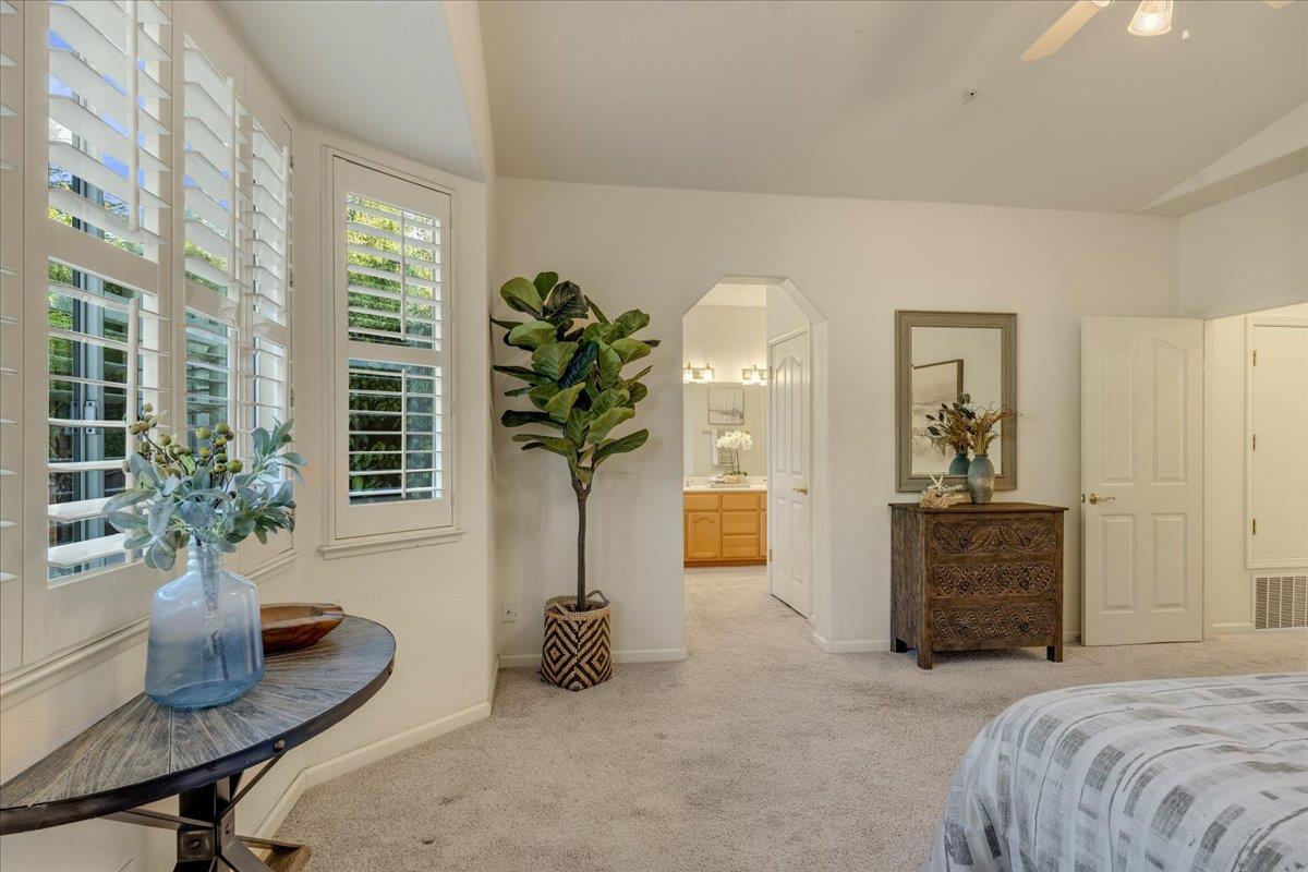 201 Augusta Lane Aptos, CA 95003 - Photo 13 of 36 a bedroom with furniture and a potted plant